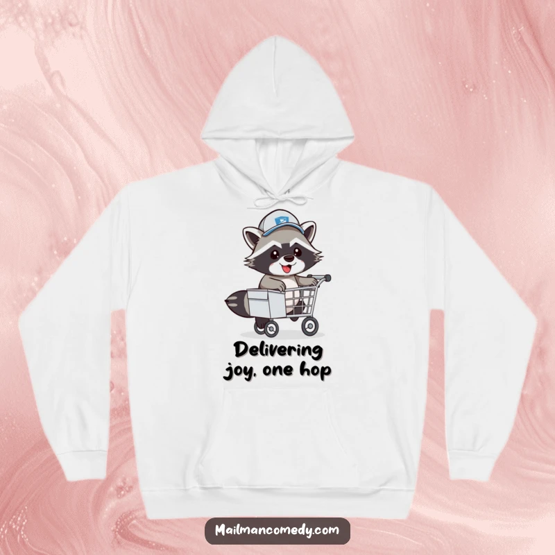 Funny Raccoon Mail Carrier Hoodie: Energetic postal worker raccoon in hat playfully leaping over a mail cart.